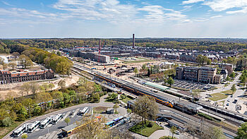 Luchtfoto van de ontwikkeling van het stationsgebied Ede-Wageningen en het Enka terrein